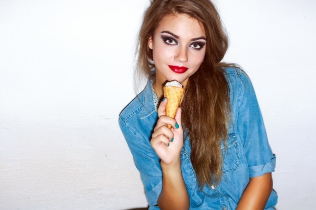 teenager-with-red-lips-eating-an-ice-cream_1140-135.